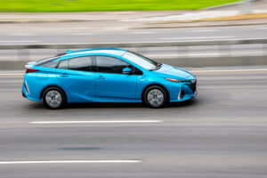 Picture of blue toyota hybrid vehicle driving to Whitley automotive for hybrid vehicle maintenance in Locust NC