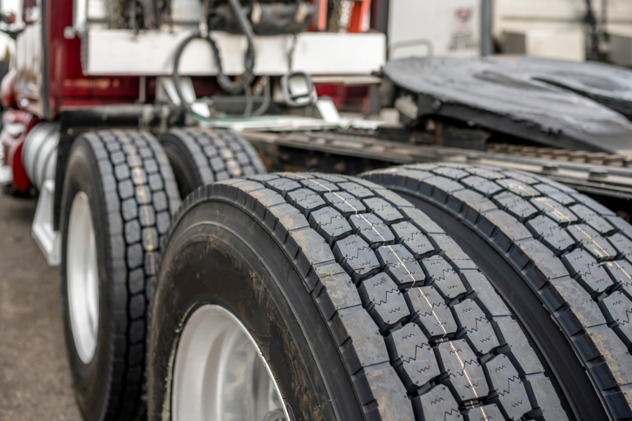 Best Commercial Tires | Whitley Automotive | Locust, NC Experts. Image of tires on a red tractor trailer.